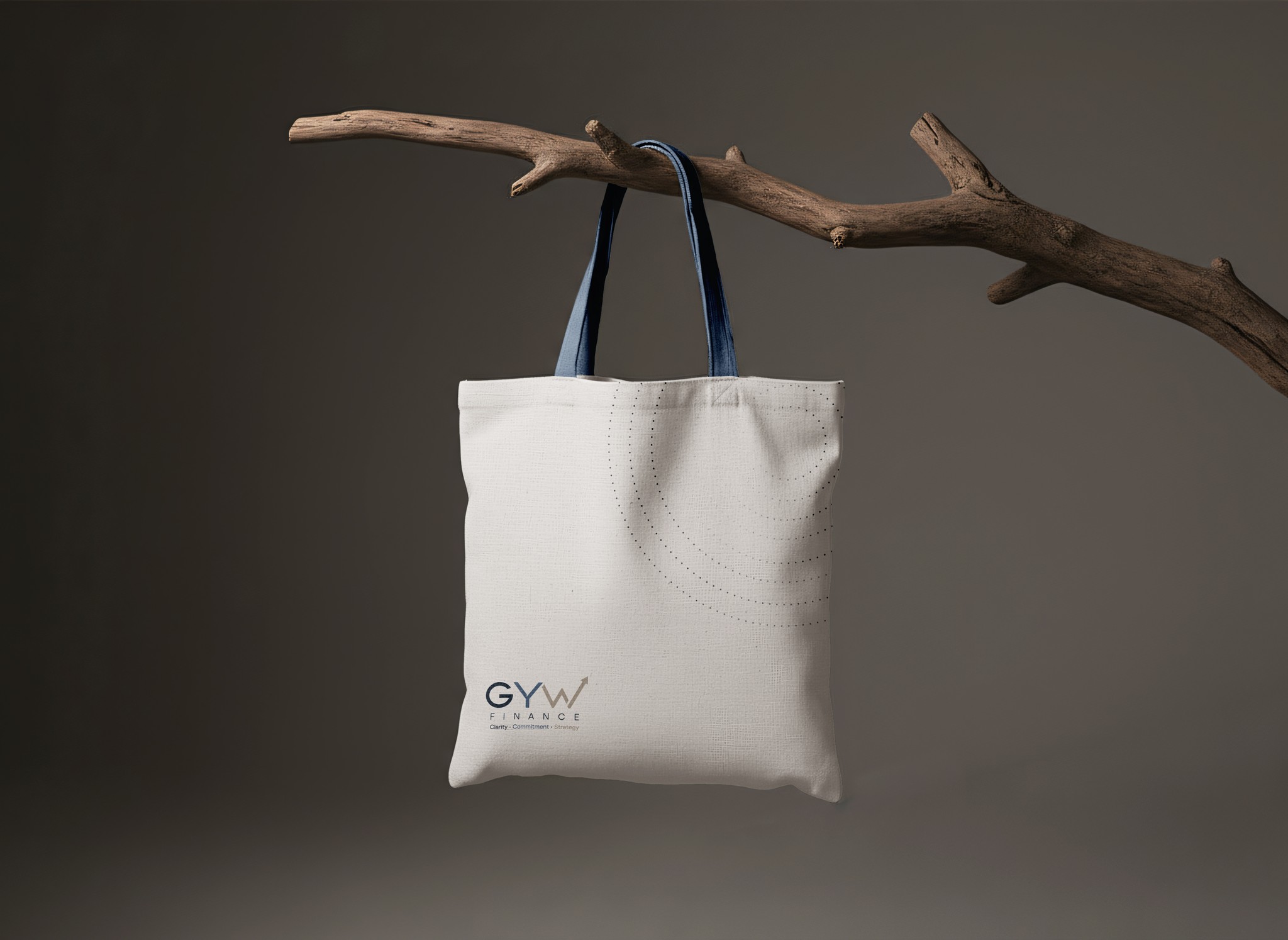 A canvas tote bag with the GYW logo