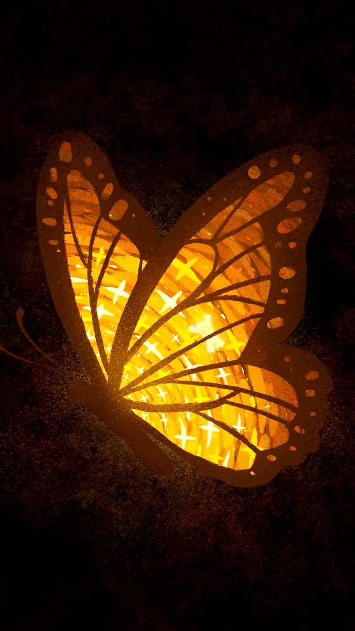 A glowing orange butterfly made of autumn leaves on a dark background