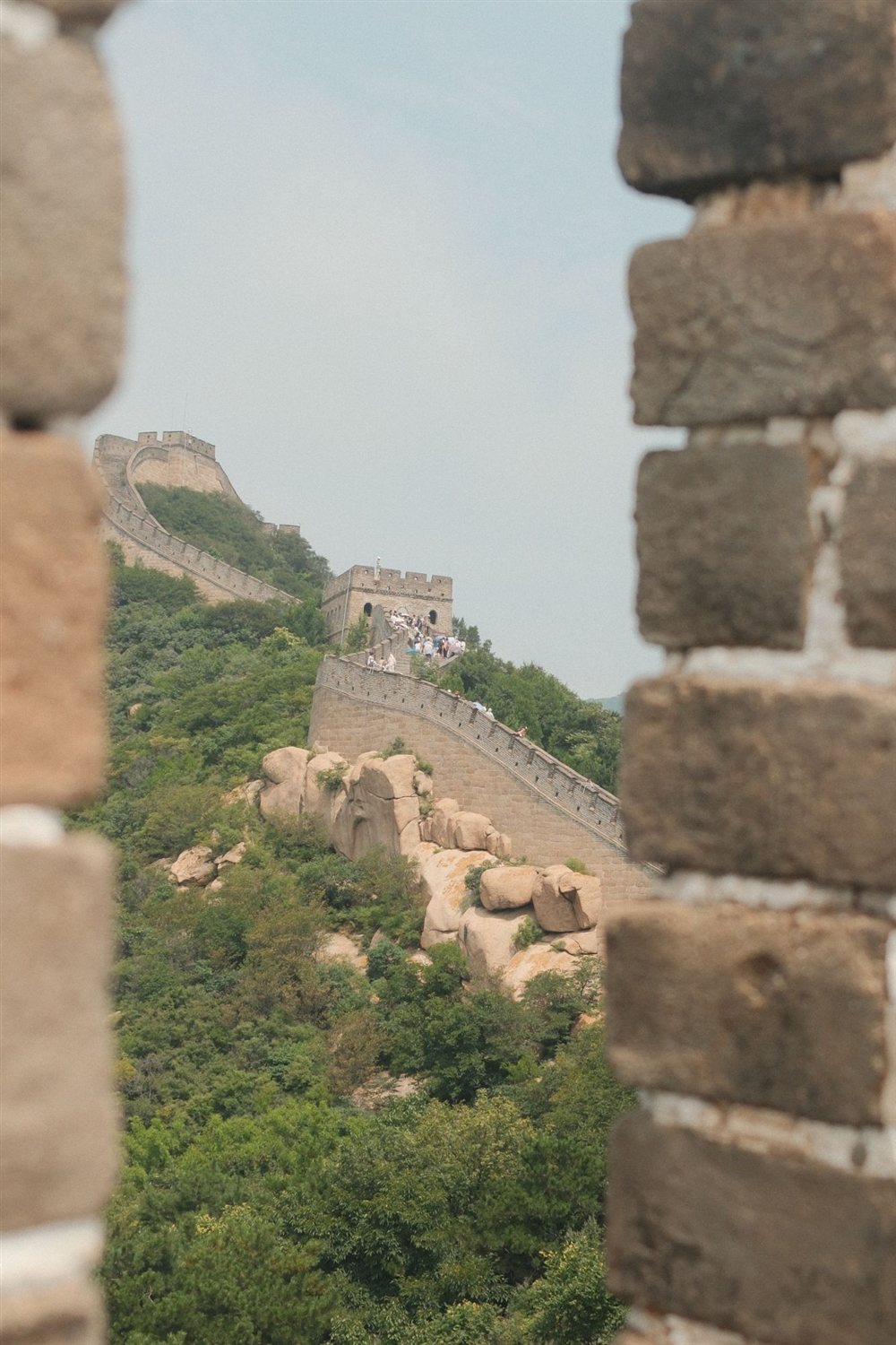 The Great Wall seen between two stone battlements